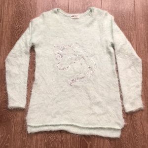 Fuzzy sweater with unicorn detailing!